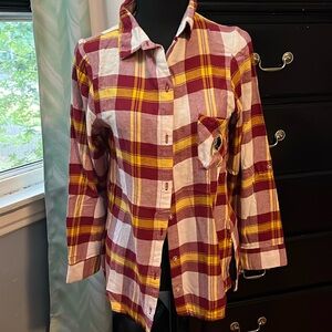 Redskins button up shirt.